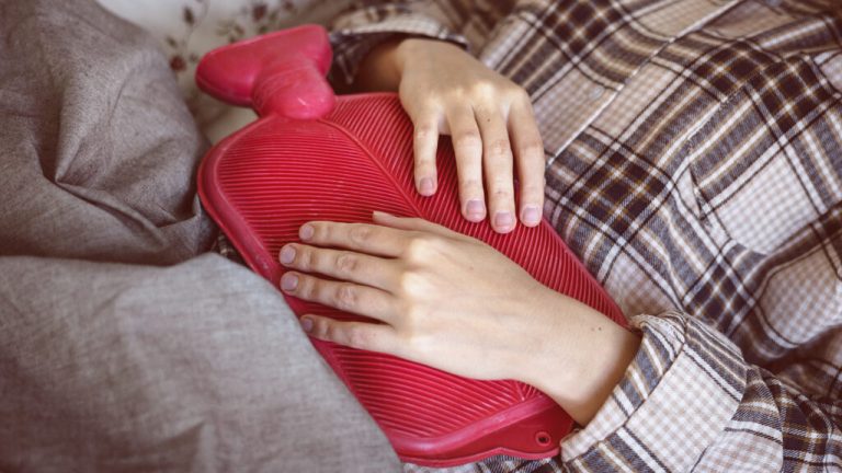 Caucasian woman having painful period cramps